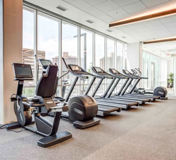Cardio Equipment in a Large Fitness Room Overlooking Chicago at North+Vine in Chicago, Illinois