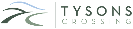 A logo with the words Tysons Crossing next to a stylized image of a road.