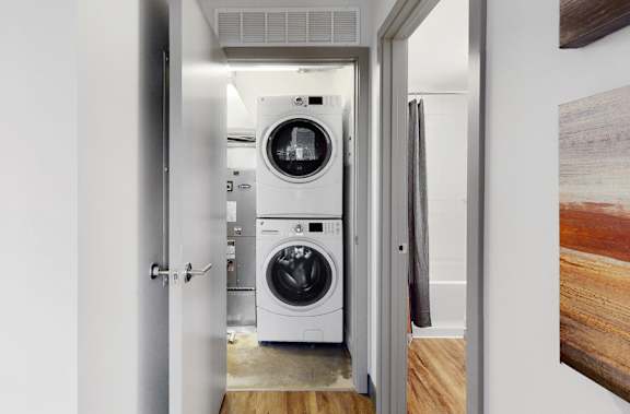 Full-size, front load, stacked washer and dryer is included in every floor plan at Midtown Crossing Apartments Omaha