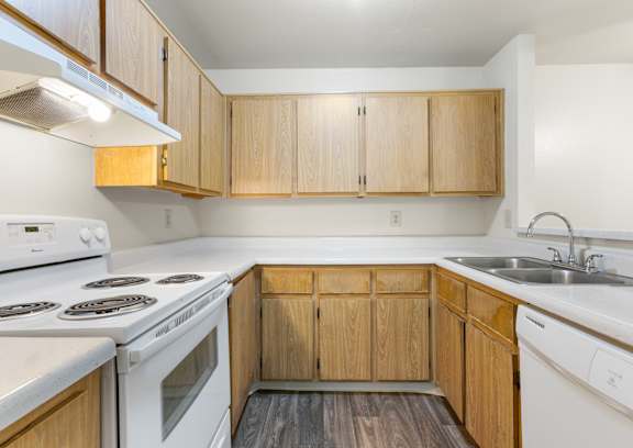 Kitchen with White Appliances at Rio Seco