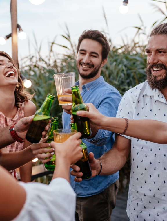 a group of people drinking wine at a bar