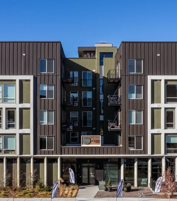 a building with two floors and two balconies