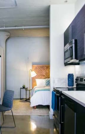 a kitchen and living room with a table and chairs at Garment Lofts, California, 90014