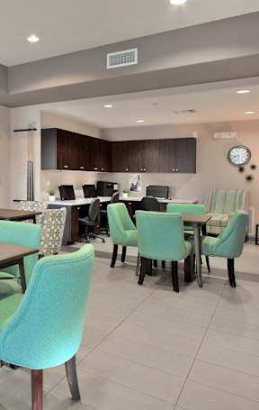A modern dining room with a table set for six.