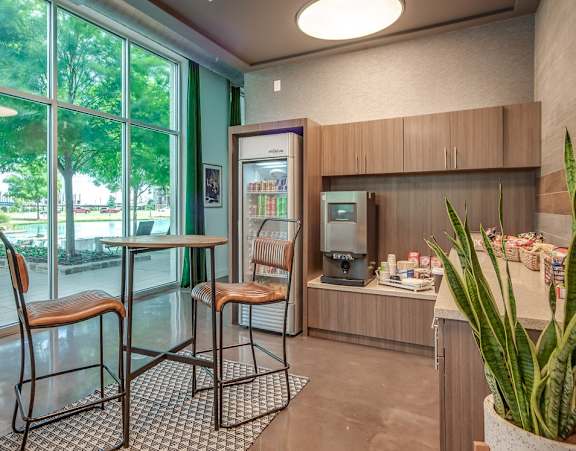 Discovery at the Realm Apartments Community Kitchen with Fridge and Snacks