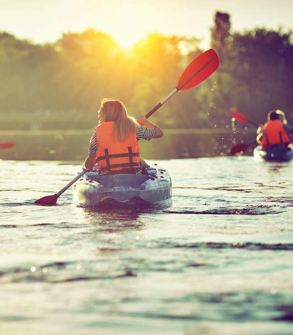 a group of people kayaking on a lake at The Lodge at Lakeline Village, Cedar Park, 78613