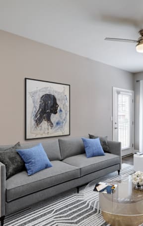 a living room and dining room with a couch and a table
