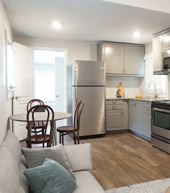 a kitchen with stainless steel appliances and a stove top oven