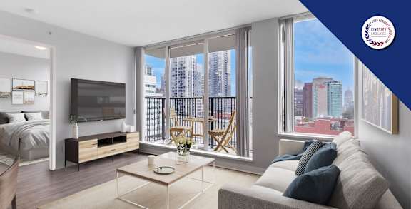 A modern living room with a large window overlooking a cityscape.