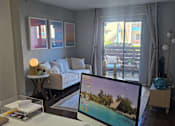 Thumbnail 1 of 33 - a desk with a computer on it in a living room