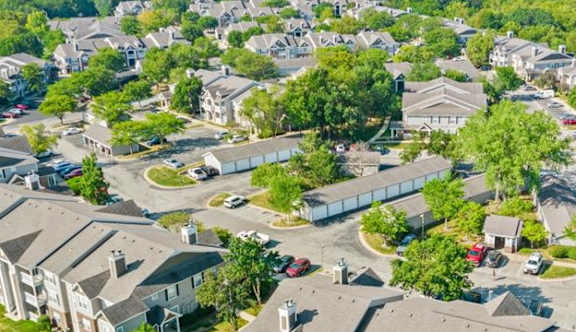 an aerial view of a neighborhood of houses at Stonebriar Woods Apartments, Overland Park