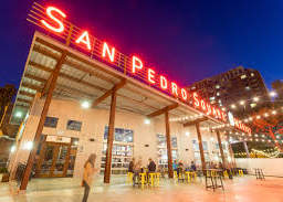 A brightly lit San Pedro's sign is seen at night.