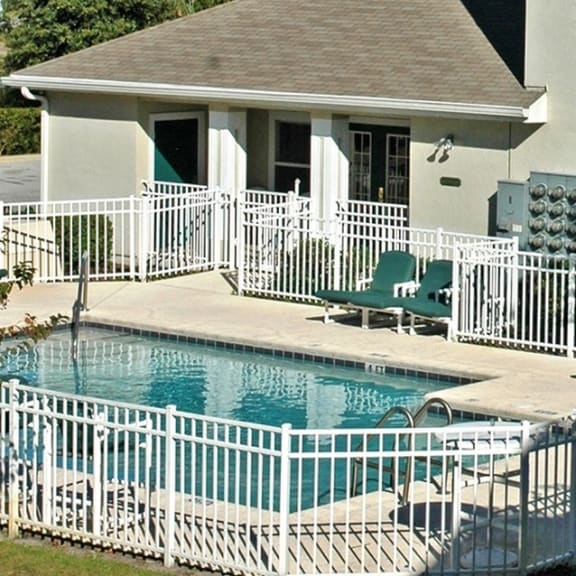 Pool and a house at Oak Glen Apartments, Orlando, 32808