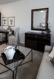a dining room with tables and chairs and a bar at Arbor Hills, Florida, 33805