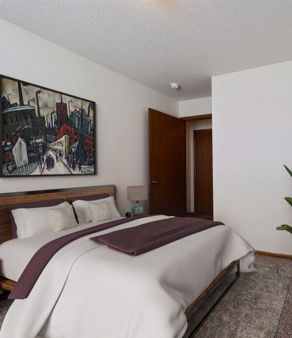 a living room with a couch and a coffee table and a tv. Fargo, ND Park Place Apartments