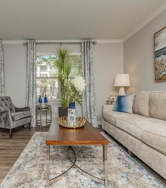 Beautiful Living Room with Long Couch at Oxbow Hill Country, Boerne, TX