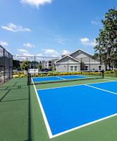 pickleball court in a fenced in area