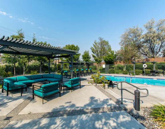 Riverpointe Apartments Pool with Lounge Chairs