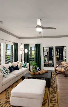 a living room and dining room with a couch and a table