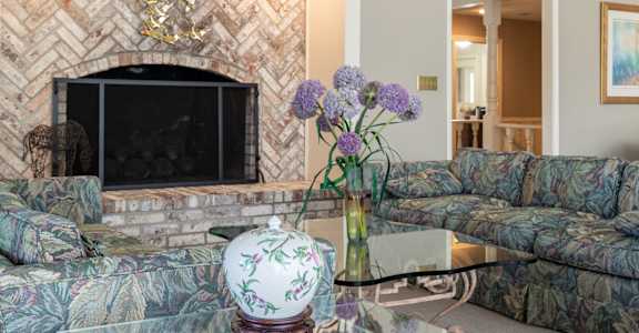 A bright and open seating area inside the clubhouse at Regent’s Walk Apartment Homes.