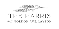 A white feather is centered on a black background.