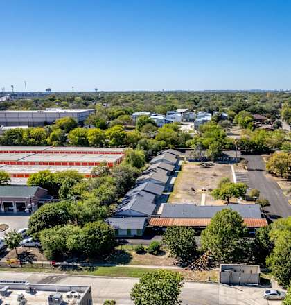 A large industrial area with a parking lot and several buildings.