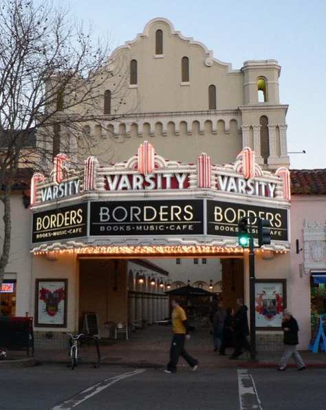 A street view of a building with a sign that says "Varsity Borders".