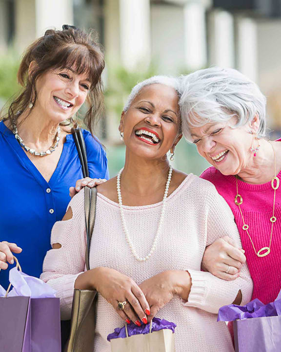 a group of women with shopping bags
