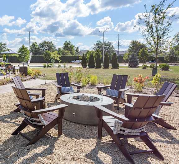 Patio with outdoor grilling stations at fifty9 Grove Apartments, Naperville, 60563
