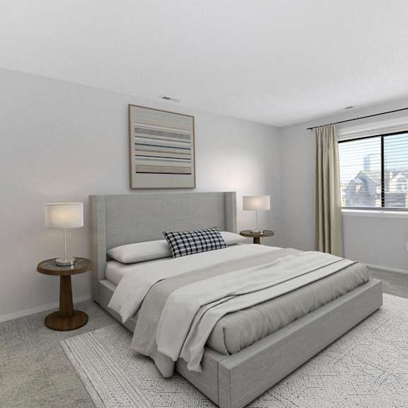 a white bedroom with a bed and a window