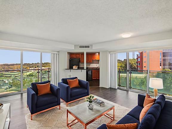 Living Room with Blue Chairs at Vista Condominiums, Kansas City, KS, 66103