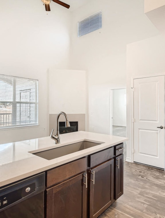 a kitchen with a sink and a refrigerator