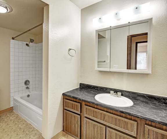 The bathroom with a sink, toilet, shower at Ladera Villa Apartments. 