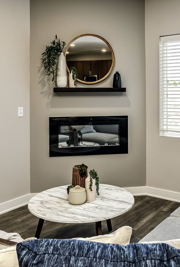 a living room with a couch and a coffee table and a television