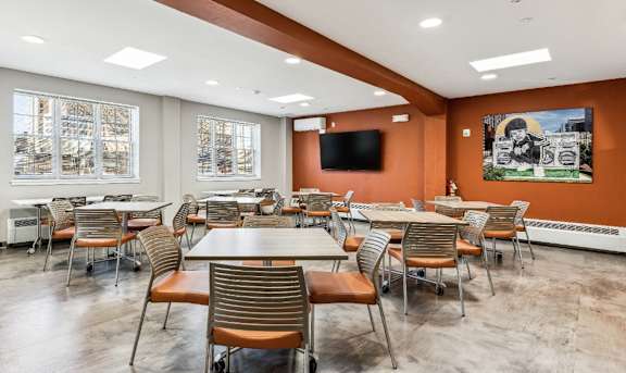 A conference room with a long table and chairs.