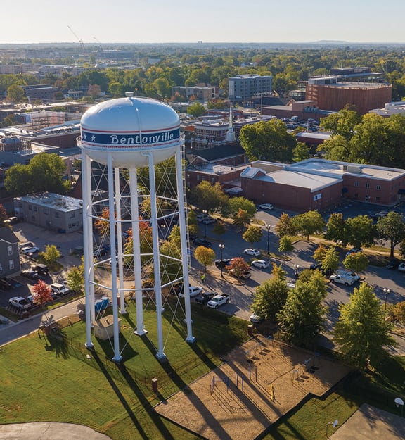 an aerial view of a water tower in the middle of a city