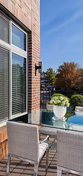 A patio with a table and chairs is shown.