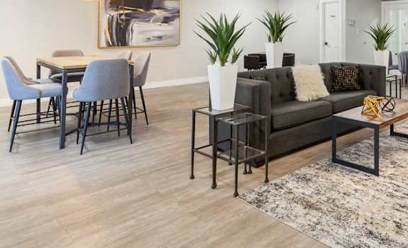 a living room with couches and chairs and a dining room table at Acacia Gardens, Albuquerque, NM, 87111