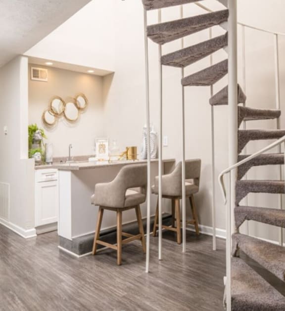 a kitchen with stainless steel appliances and white cabinets
