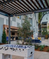a ping pong table in the courtyard of a building