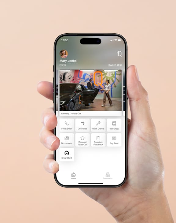 A hand holding a smartphone with a photo editing app open.
