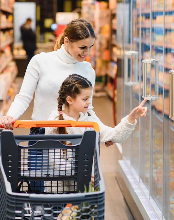 A woman and a child are shopping in a grocery store.at Latitude 2976, Houston, TX
