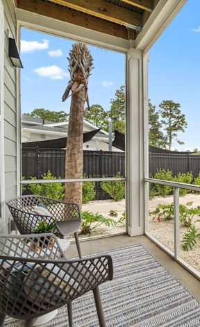 Porch with two chairs at The Quinn Luxury Apartments, Pensacola, FL