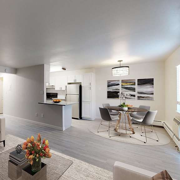 A living room with a grey couch and a coffee table.