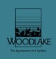 A logo for Woodlake apartments in a garden.