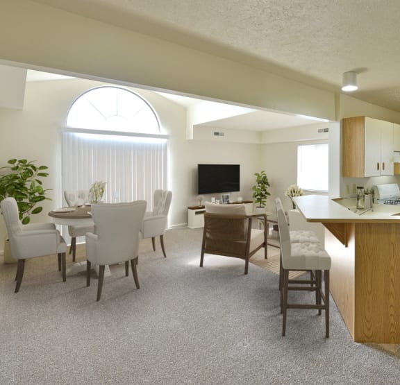 a living room with a couch and a television at Heatherwood Apartments, Grand Blanc