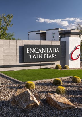 a view of the sign at the entrance to the encantada saguaro national park