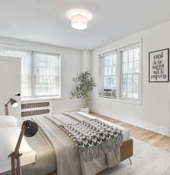 a living room with a couch and a table and chairs