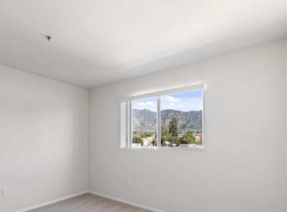 a room with white walls and a window at Dronfield Astoria Apartments, Sylmar ,91342