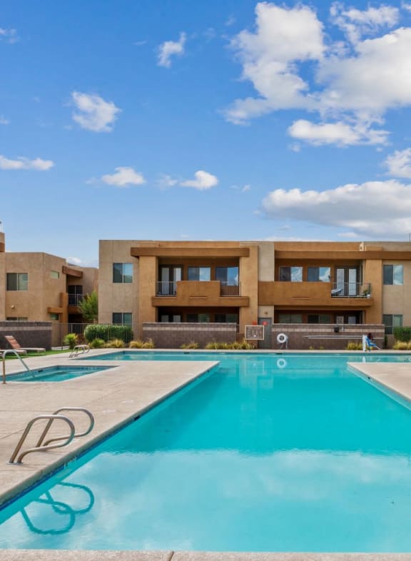 our apartments have a large swimming pool with lounge chairs at Pima Canyon, Tucson, Arizona